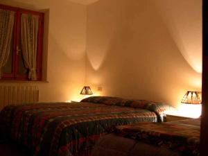 Ein Bett oder Betten in einem Zimmer der Unterkunft Appartamento tramonto