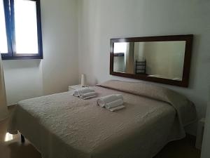 Postel nebo postele na pokoji v ubytování Masseria Prisuti