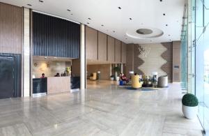 a lobby of a building with people sitting in the lobby at One Madison Place, Tower 2 - 10N MEGAWORLD Iloilo in Iloilo City