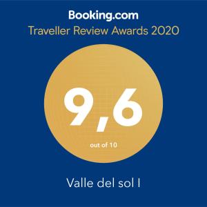 a sign that reads travel review awards with a yellow circle at Valle del sol I in Pajares