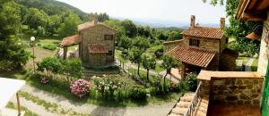 an aerial view of a garden with two buildings at Agriturismo Ombianco in Seggiano