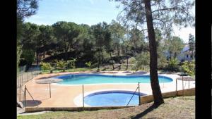 a large swimming pool with a fence around it at Villa Rosa Amparo in Córdoba