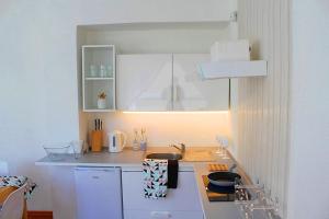 Kuchyň nebo kuchyňský kout v ubytování Apartament Central Sopot
