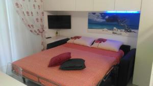 a room with a bed with two pillows on it at aMare il mare in Porto Recanati
