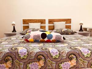 a bed with pillows on top of it at Apartment Karin in Rijeka