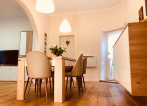 a dining room with a table and chairs at Apartment Karin in Rijeka