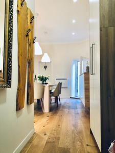 a dining room and living room with a table and chairs at Apartment Karin in Rijeka