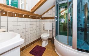 a bathroom with a toilet and a glass shower at Ranch Frida in Vodice +71 photos