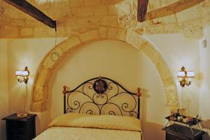 Posteľ alebo postele v izbe v ubytovaní Trulleto - Casa Vacanze