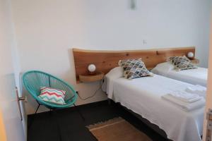 A bed or beds in a room at Adega do Xelica - Holiday Cottage