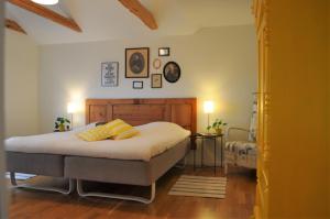 a bedroom with a bed with two pillows on it at Villa Sandby B&B in Borrby