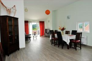 a dining room with a table and chairs at Apartment Fiorenini 2 in Mlini