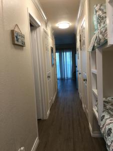 a hallway of a home with a hallway at Spectacular Beach View! in Corpus Christi