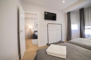 A bed or beds in a room at Apartamento céntrico Logroño Confort con Aire Acondicionado