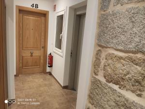 a hallway of a house with a door at Villa Trabazos Abellas in Ourense