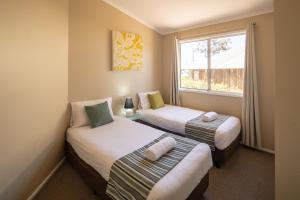 Llit o llits en una habitació de Ingenia Holidays Hunter Valley