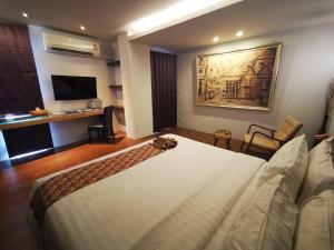 TV a/nebo společenská místnost v ubytování Mandy Nok Hotel