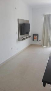 Televiisor ja/või meelelahutuskeskus majutusasutuses Dos Marias