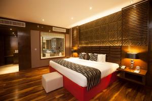 Ramada by Wyndham Alleppey客房内的一张或多张床位