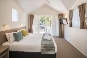 Postel nebo postele na pokoji v ubytování Ingenia Holidays Lake Macquarie