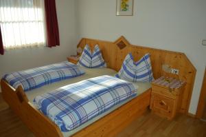 A bed or beds in a room at Residence Rogger