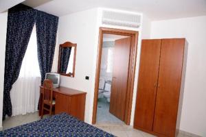 Postel nebo postele na pokoji v ubytování Hotel Castelmonardo