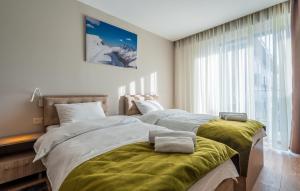 Un ou plusieurs lits dans un hébergement de l'établissement ATRIUM "Ski & Relax"