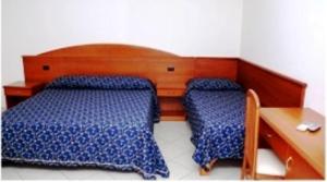 Postel nebo postele na pokoji v ubytování Hotel Castelmonardo