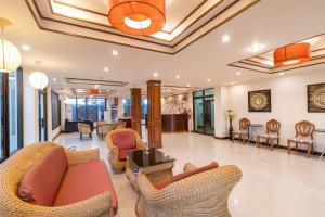 The lobby or reception area at The Palm Garden Hotel