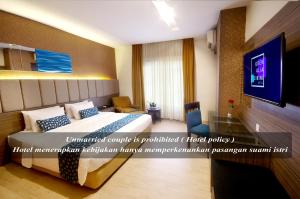 Postel nebo postele na pokoji v ubytování Hotel Gren Alia Cikini