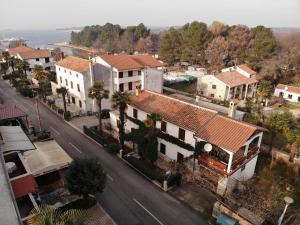 an aerial view of a town with houses and a street at Anamarija Apartments near the beach and the fantastic Adria Sea with over 10 small islands close by in Funtana