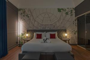 Postel nebo postele na pokoji v ubytování Palco Rooms&Suites