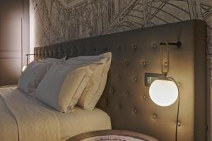 Postel nebo postele na pokoji v ubytování Palco Rooms&Suites