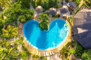an overhead view of a swimming pool at a resort at Zanzibar Queen Hotel in Matemwe