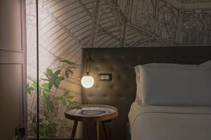 Postel nebo postele na pokoji v ubytování Palco Rooms&Suites