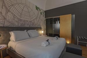 Postel nebo postele na pokoji v ubytování Palco Rooms&Suites