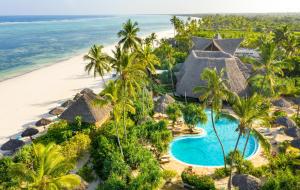 an aerial view of a resort with a swimming pool and the beach at Zanzibar Queen Hotel in Matemwe