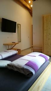 Postel nebo postele na pokoji v ubytování Bellevue Chambres d'hôtes