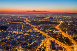 
an aerial view of a city at night at Divani Caravel in Athens
