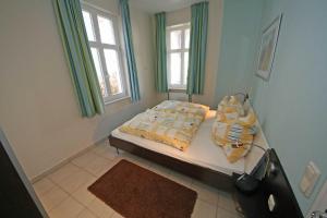 Ein Bett oder Betten in einem Zimmer der Unterkunft Haus Möwe I Whg 02 mit Terrasse