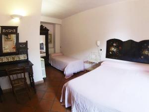 Postel nebo postele na pokoji v ubytování Agriturismo Terre di Mare Bordighera