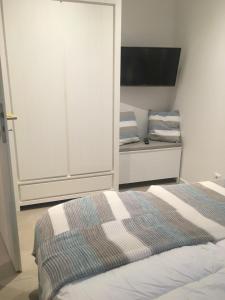 Postel nebo postele na pokoji v ubytování Inselhafen
