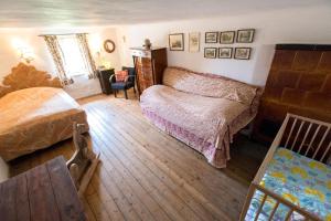 Rúm í herbergi á Chalet Hinterbreiteneben