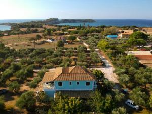an aerial view of a house with the ocean in the background at Areti Orfeas Studios in Vasilikos