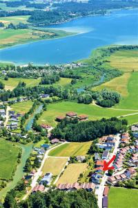 an aerial view of a neighborhood with a lake at Haus am Weinberg II in Seekirchen am Wallersee