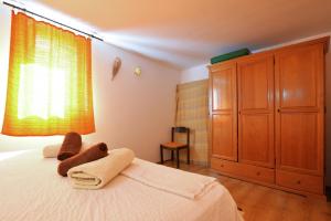 Postel nebo postele na pokoji v ubytování Kornati Robinzon House