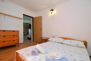 Postel nebo postele na pokoji v ubytování Kornati Robinzon House