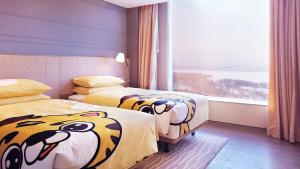 Postel nebo postele na pokoji v ubytování Shangri-La Songbei, Harbin