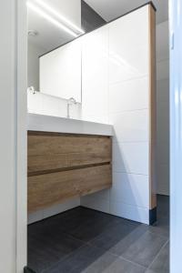 a bathroom with a sink and a mirror at Gorgeous And Stylish Place For Two In Hip West! in Amsterdam