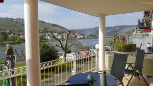 a balcony with a view of a river and mountains at Haus Brandenburg an der Mosel in Zell an der Mosel